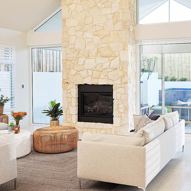 white stone fireplace in living room