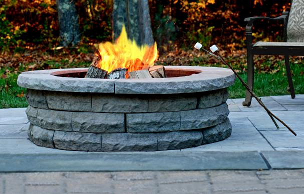 outdoor fire pit with marshmallows on sticks