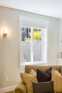 Rockwell egress window installation in Duluth, MN, featuring a custom stone retaining wall by Alliance Inc.