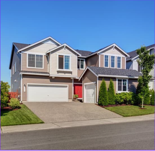 Two story house with a short driveway to the road